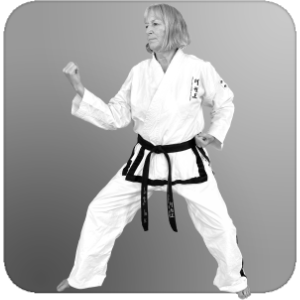 Person in back stance executing a middle inner-forearm block outward.