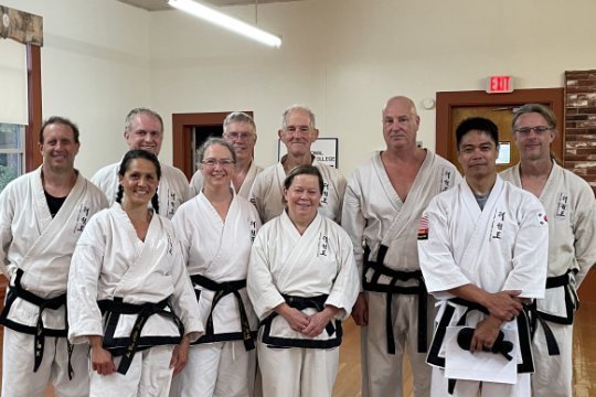 Black belts gathered for a group photo after a promotion in Alger, Washington.